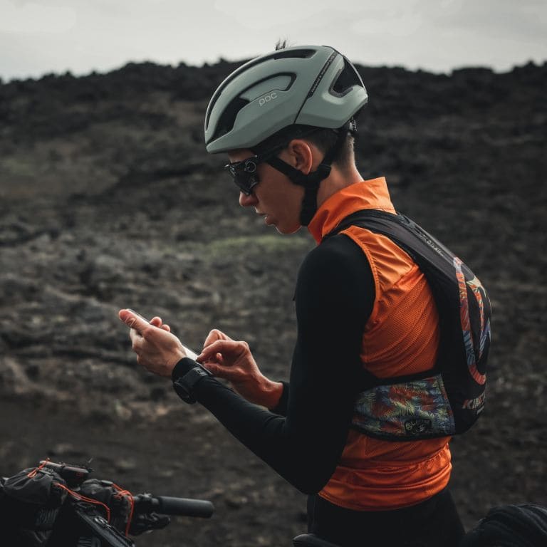 cyclist looks at maps