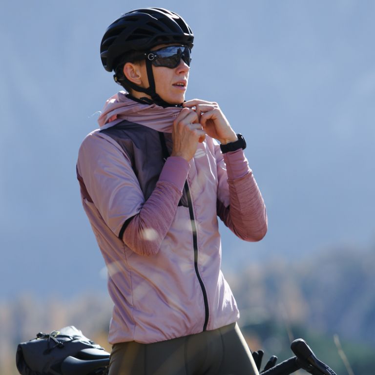 Woman with gravel jacket and equipment