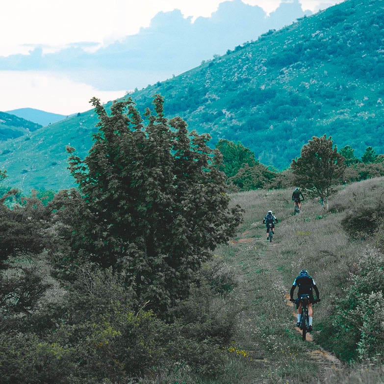 gravel cyclist with mountain landscape