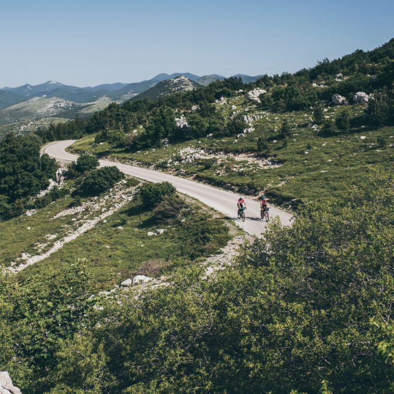 mountain landscape with cyclists