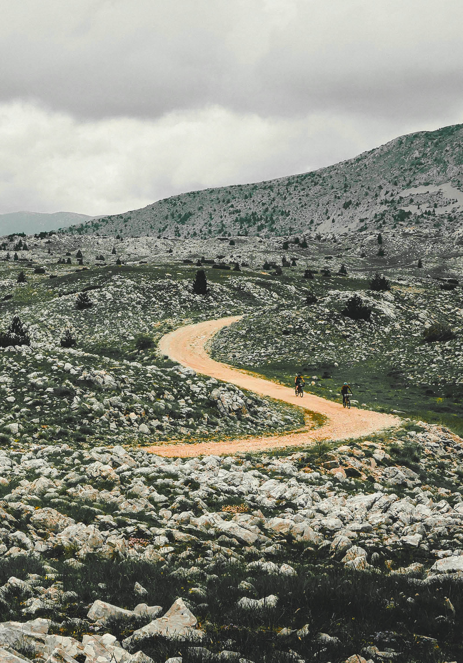 gravel cyclist with mountain landscape